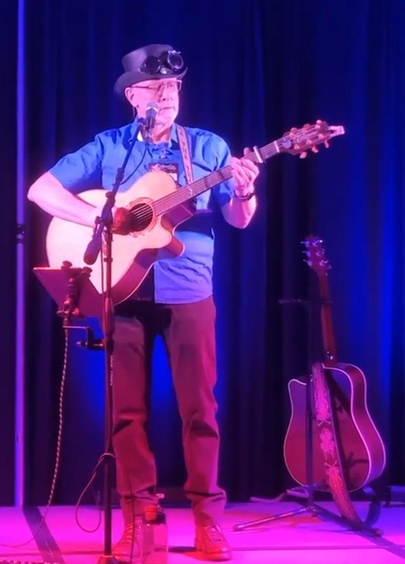 Stace performs onstage at WhimsyCon.